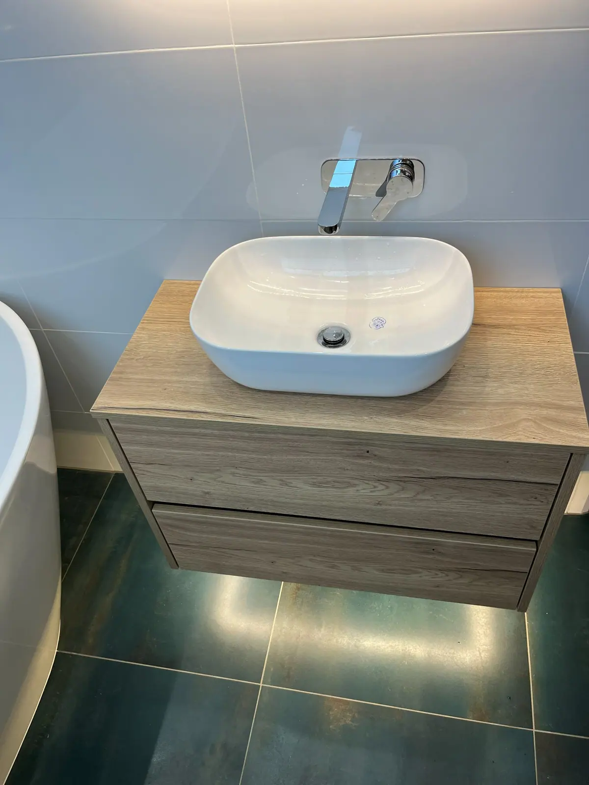 The timber vanity unit and countertop basin