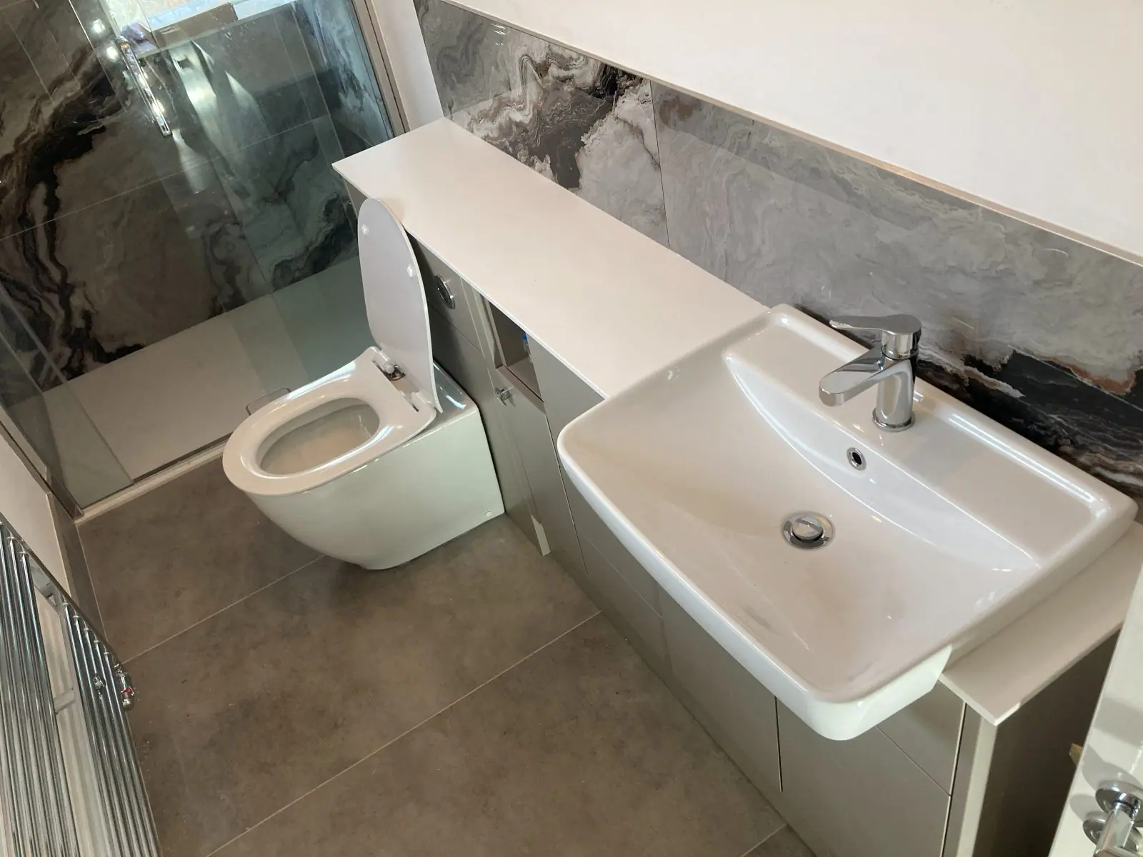 The vanity unit, basin and back-to-wall toilet