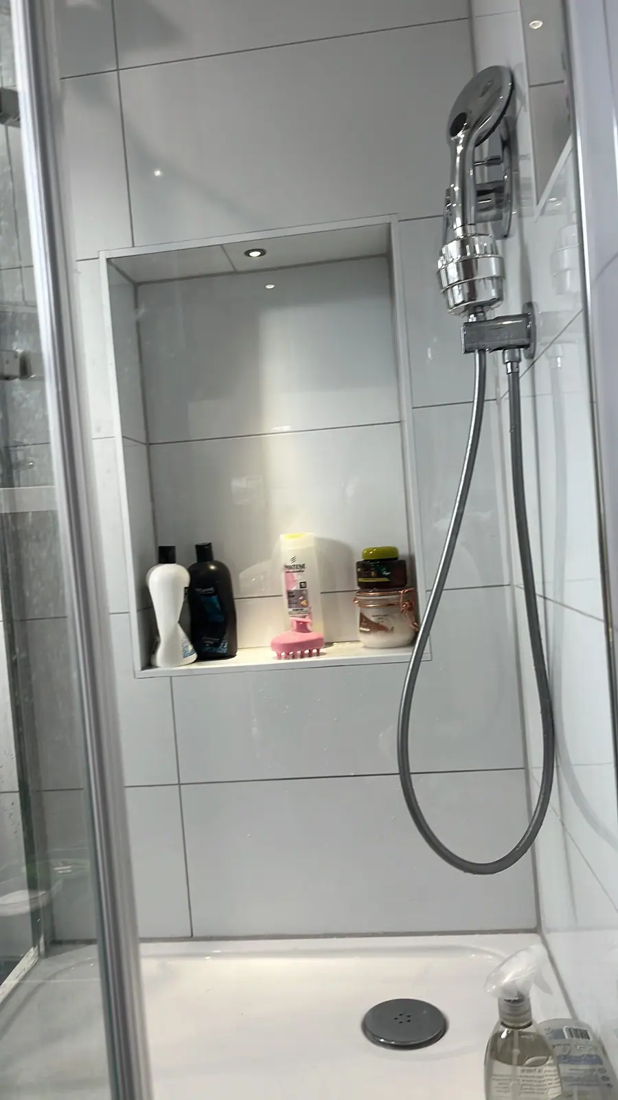 The tiled niche inside the shower