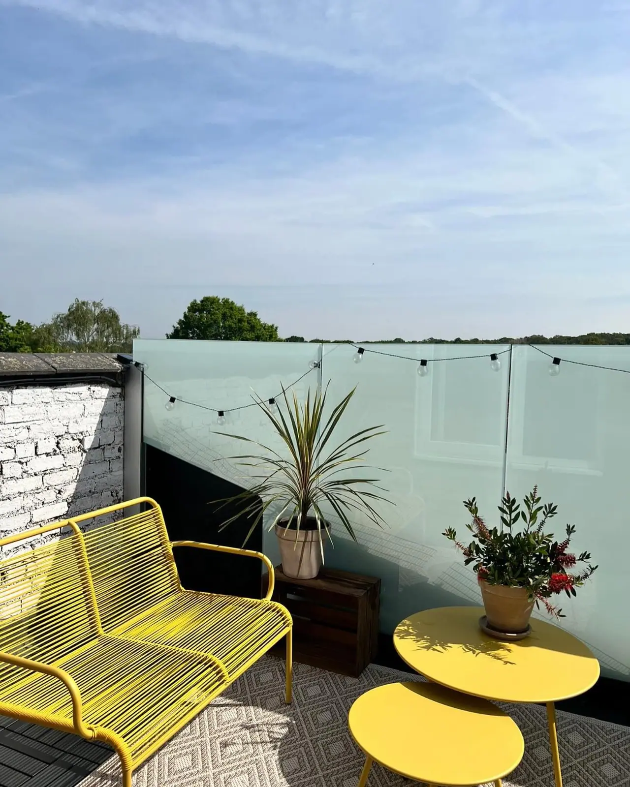 The same terrace from the other corner, looking along the glass balustrade