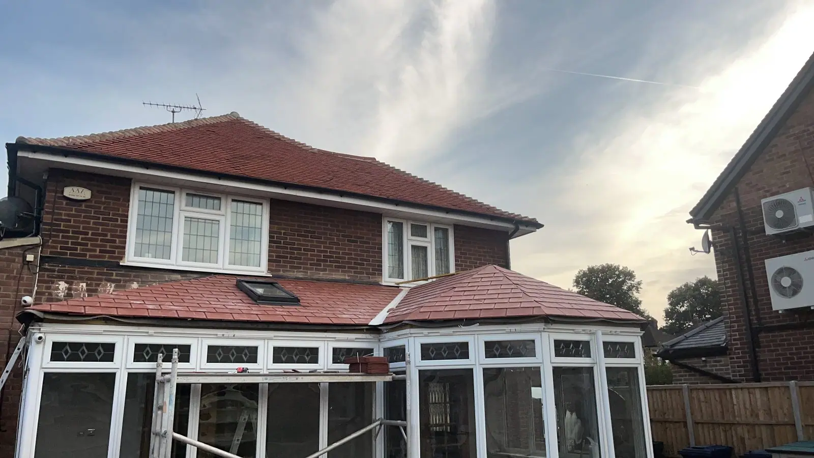 The same conservatory roof from the garden in the evening