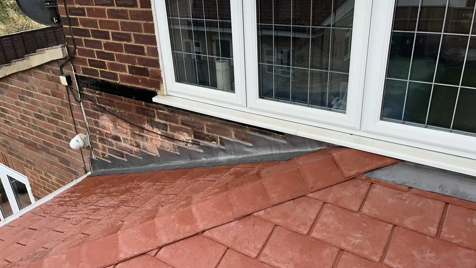 Detail of the abutment where the new roof meets the brickwork