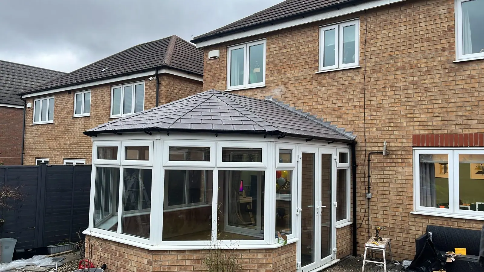 The conservatory under its new solid grey tiled roof