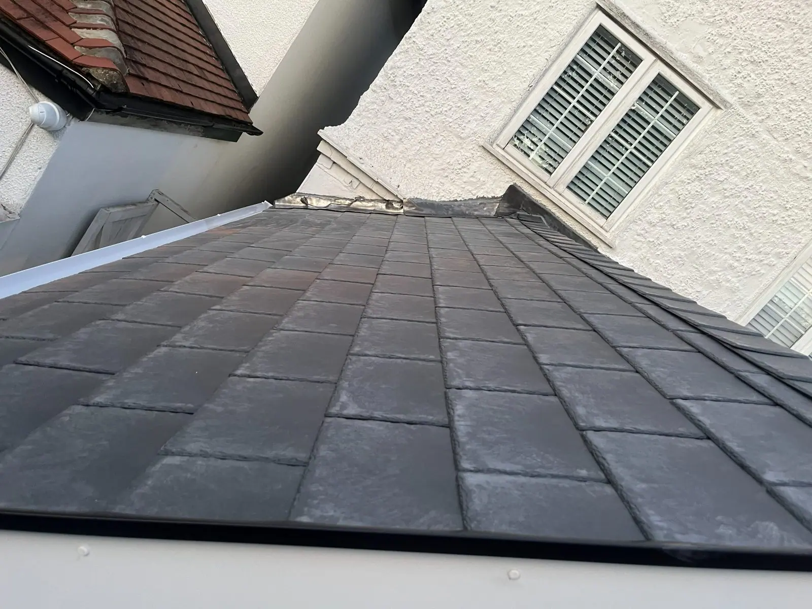 The finished covering seen along the roof slope