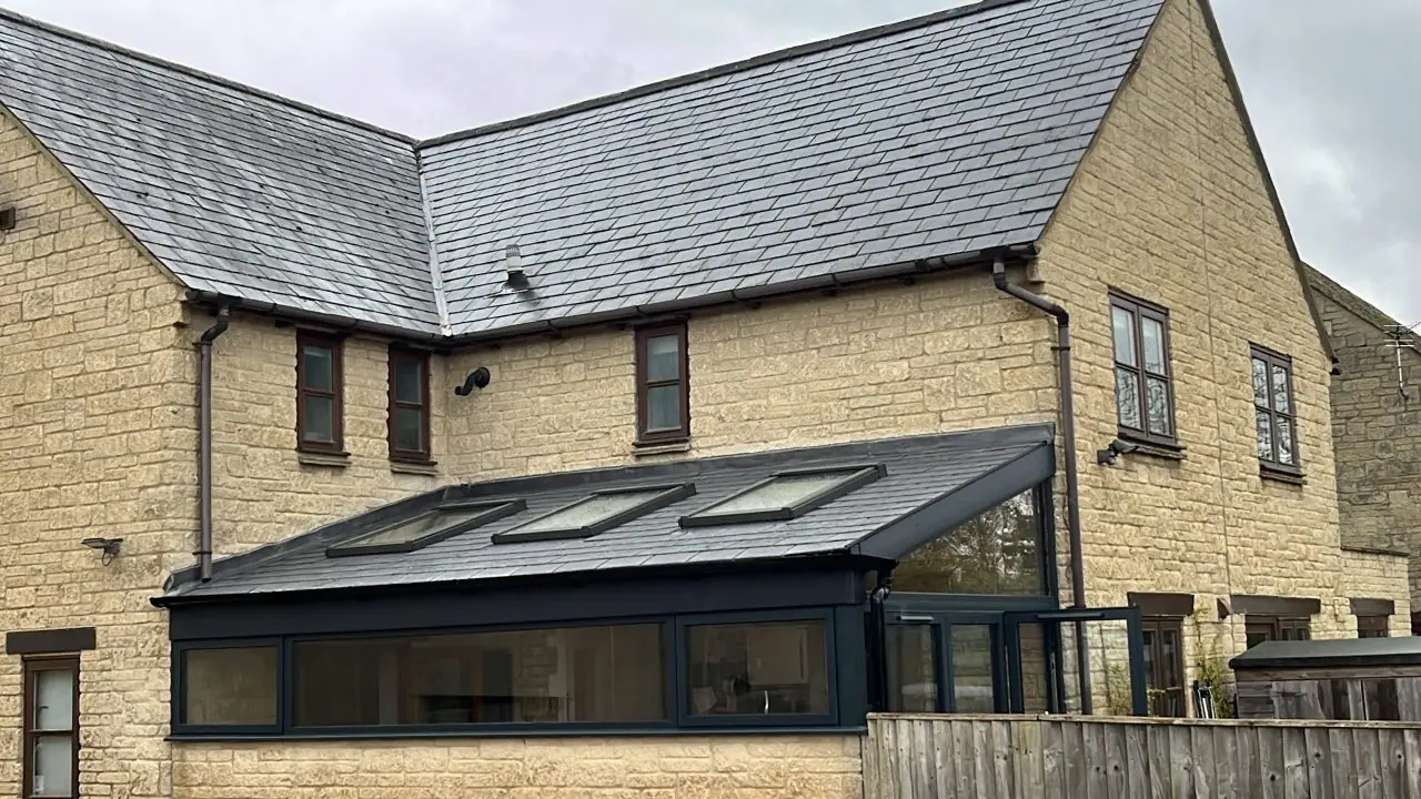 The finished garden room with its slate roof and three roof lights