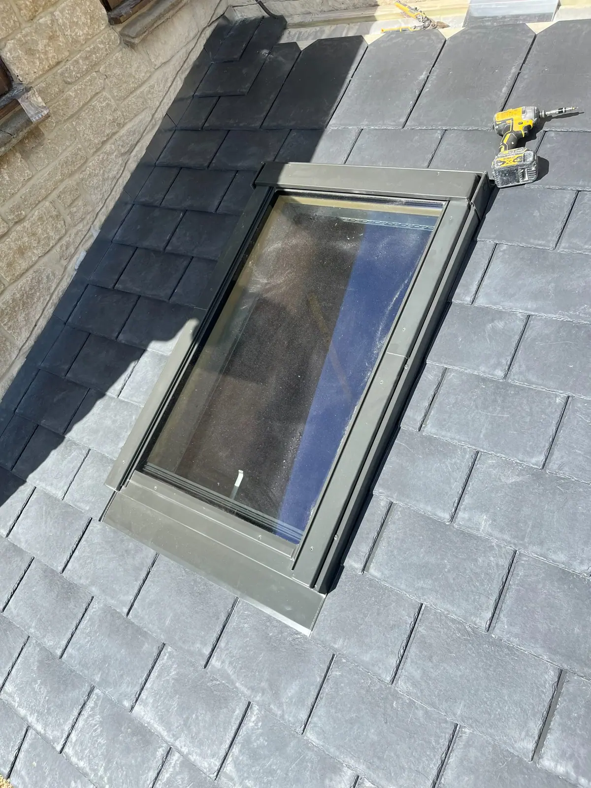 Close view of a finished roof light in the slate covering