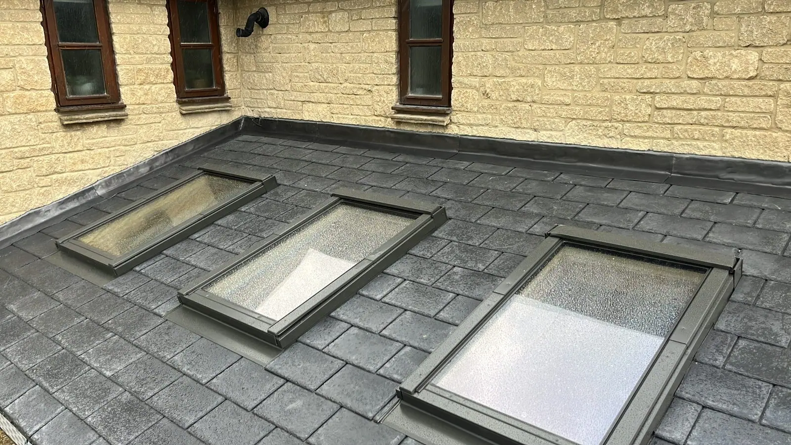 The slate roof with its three roof lights
