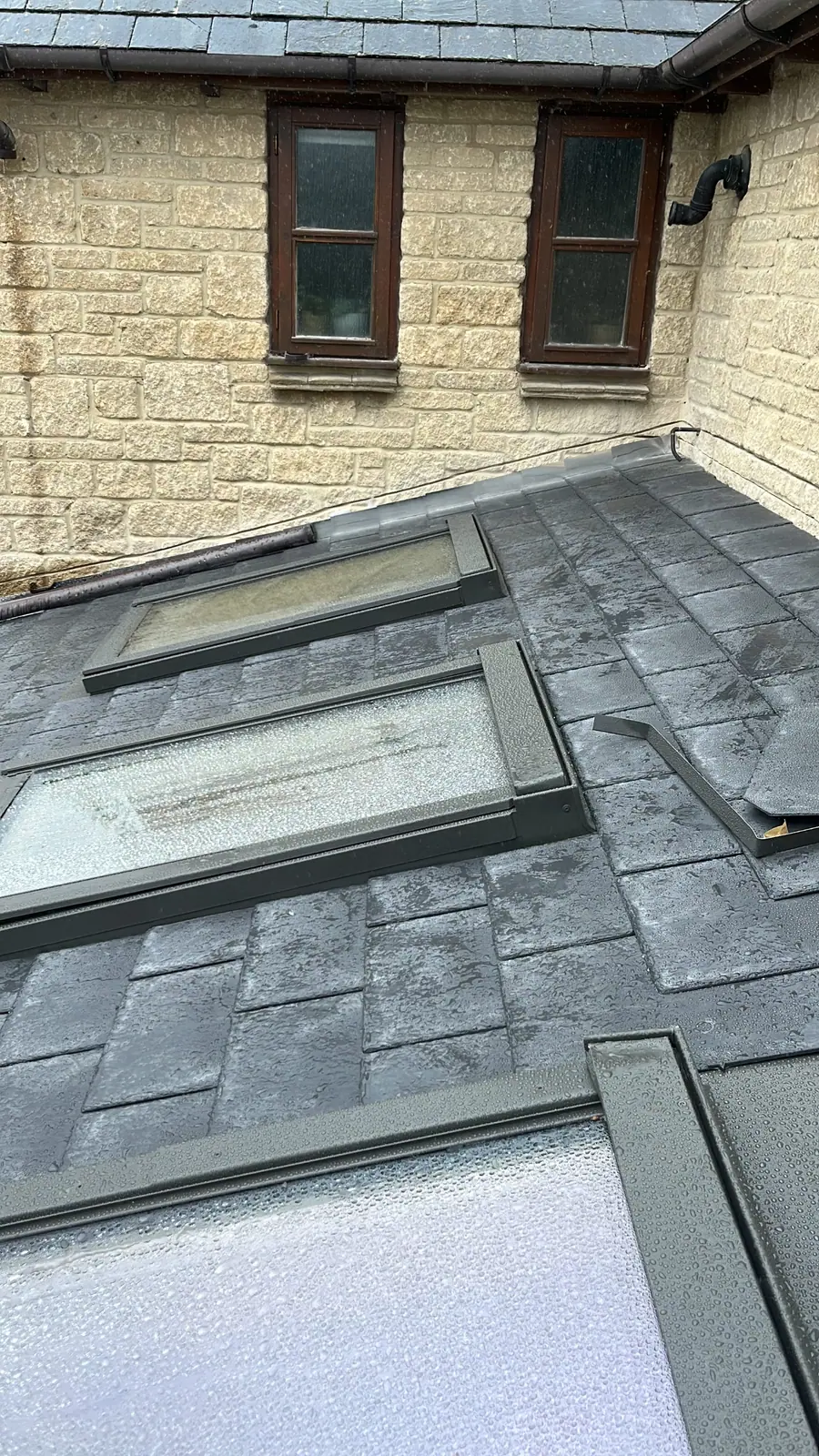 The finished slate roof and roof lights from above