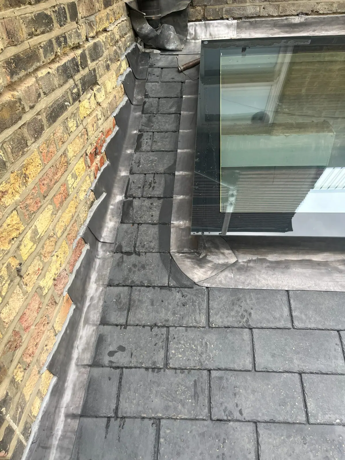 Detail of the lead flashing where the roof meets the wall