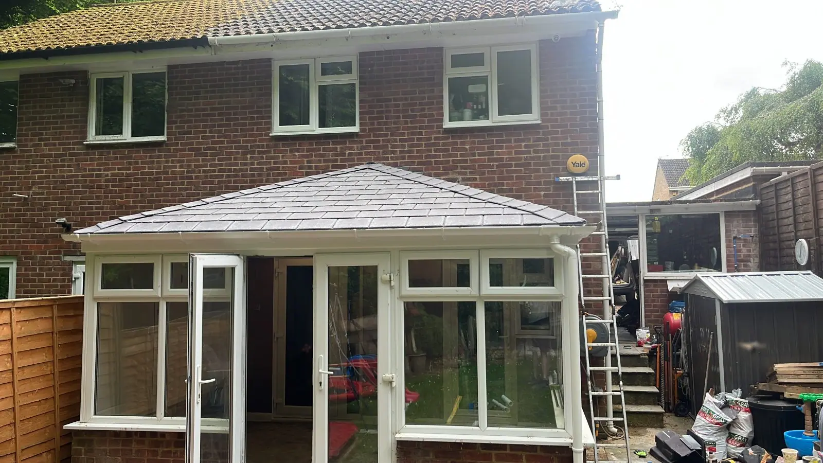 The finished conservatory with its solid grey tiled roof