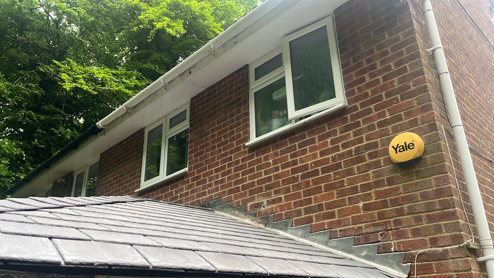 Close view of the tiles meeting the house wall