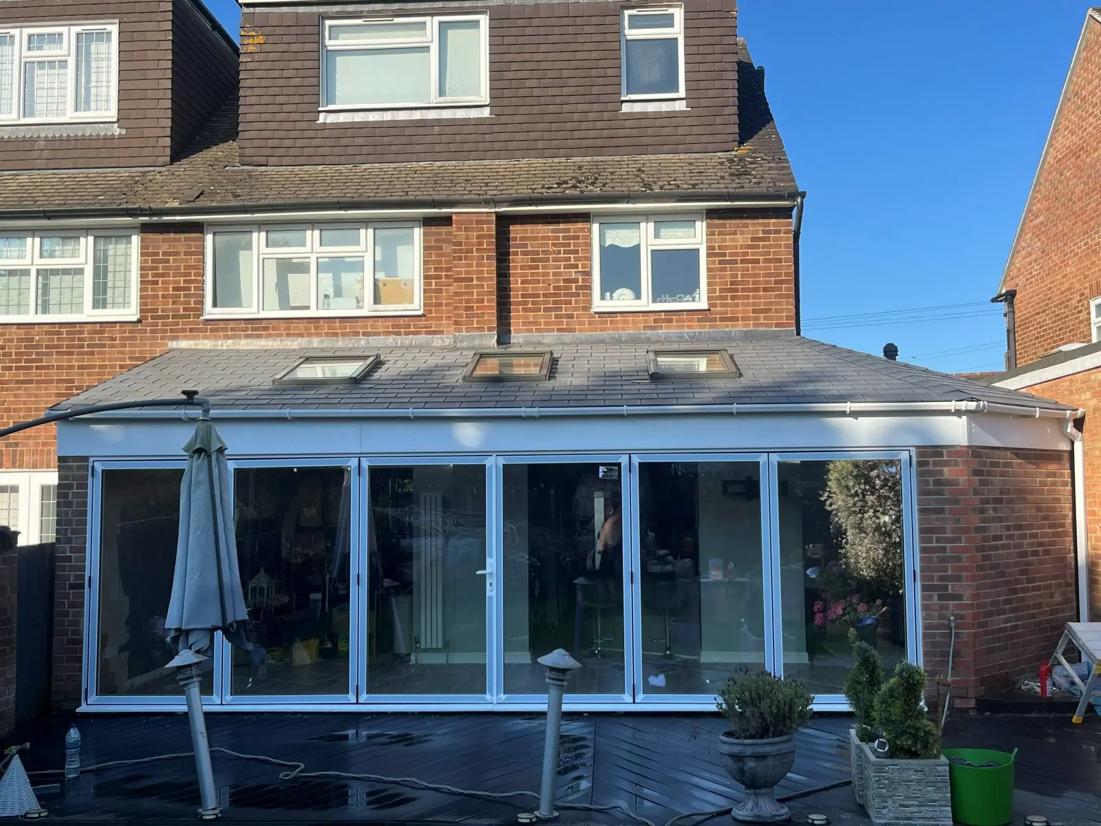 The finished rear room and its roof windows from the garden