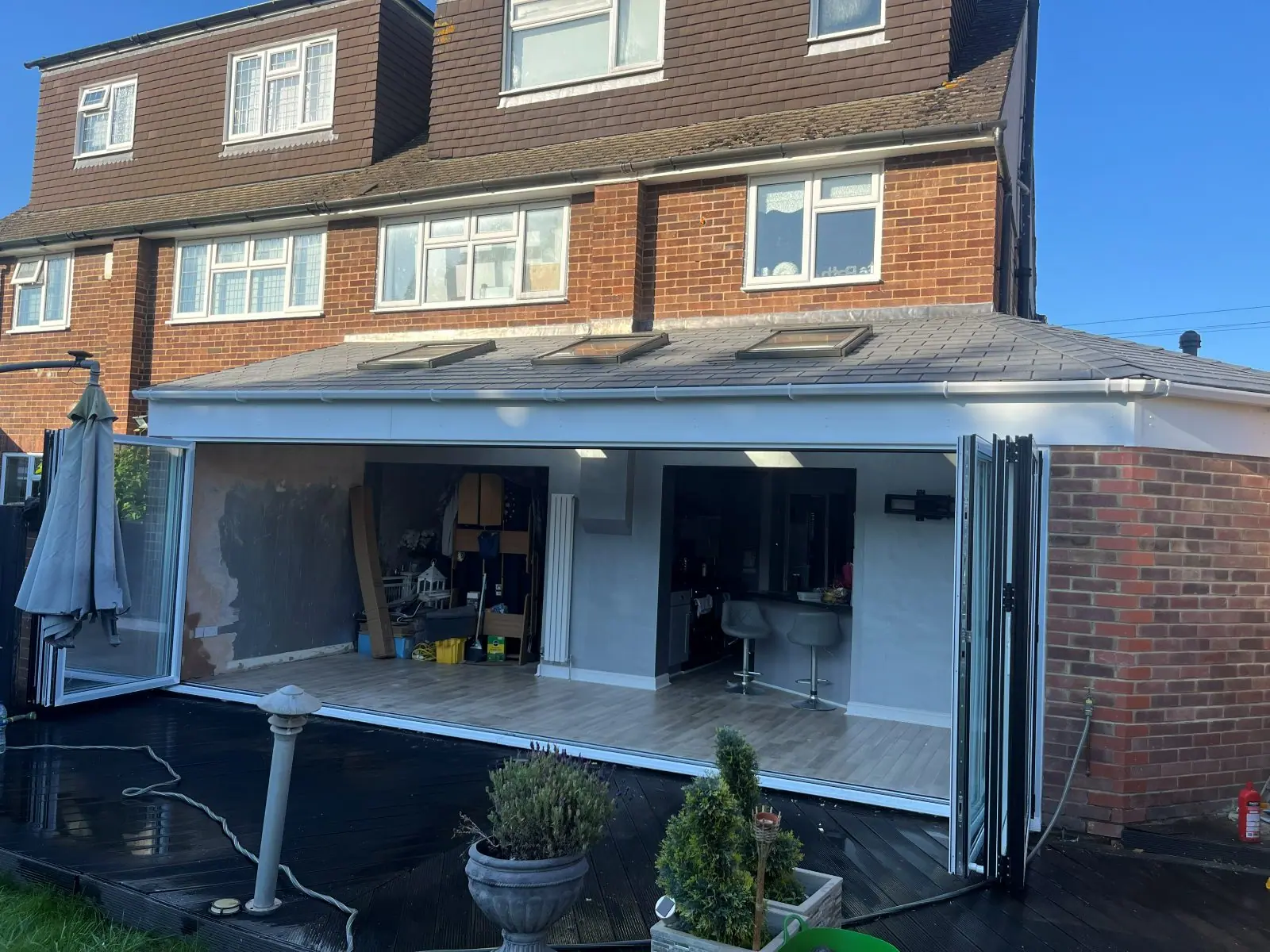 The bi-folds open onto the finished interior