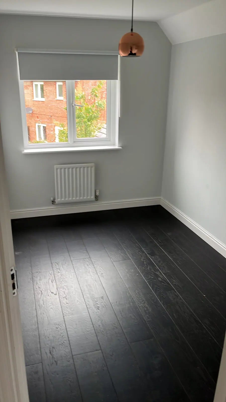 The same floor cleaned and refinished to an even sheen