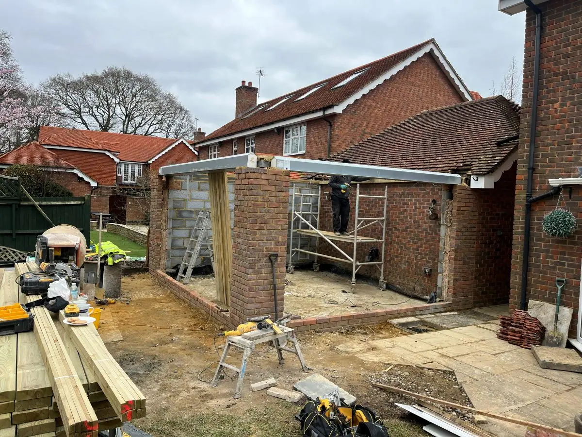 The walls of the rear room built up to plate height, with lintels over the openings