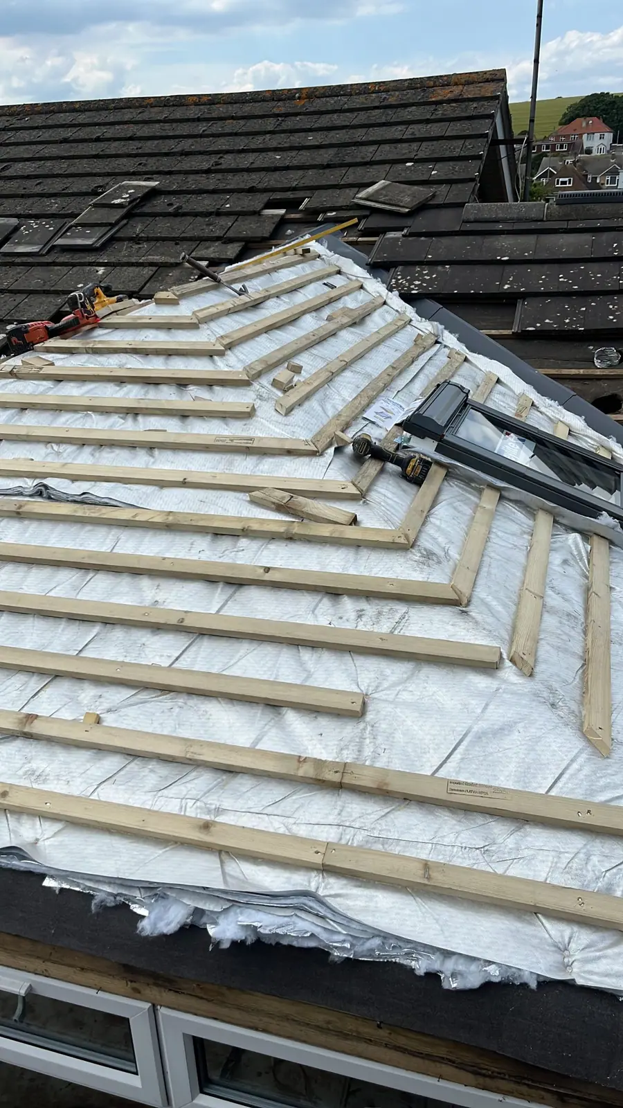 New breathable membrane and timber battens set out on a roof before the tiles go on