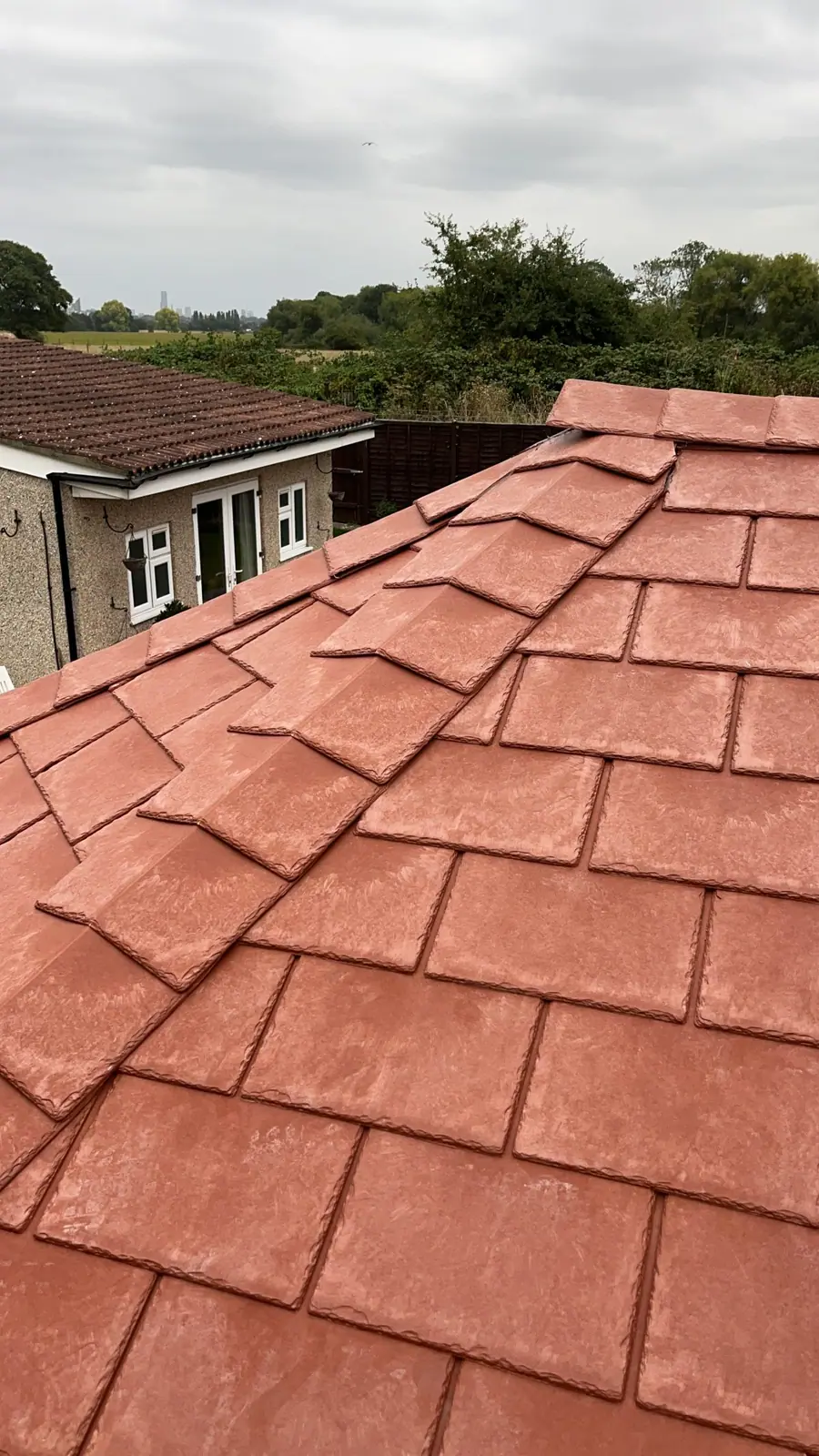 New clay plain tiles laid to an even course and gauge