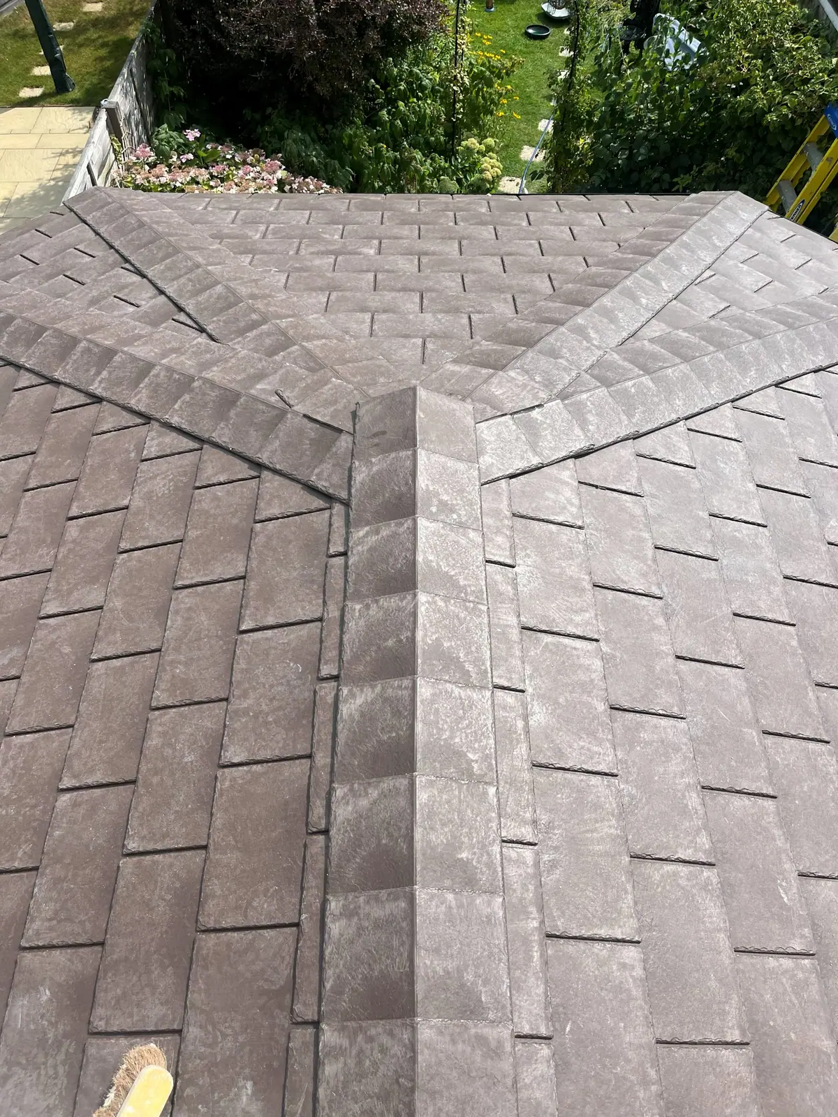 Close view of the new tile courses running into the hip