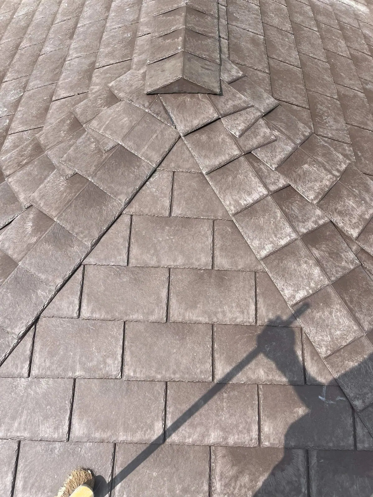 Close view of the hip and ridge, showing the tile courses meeting square