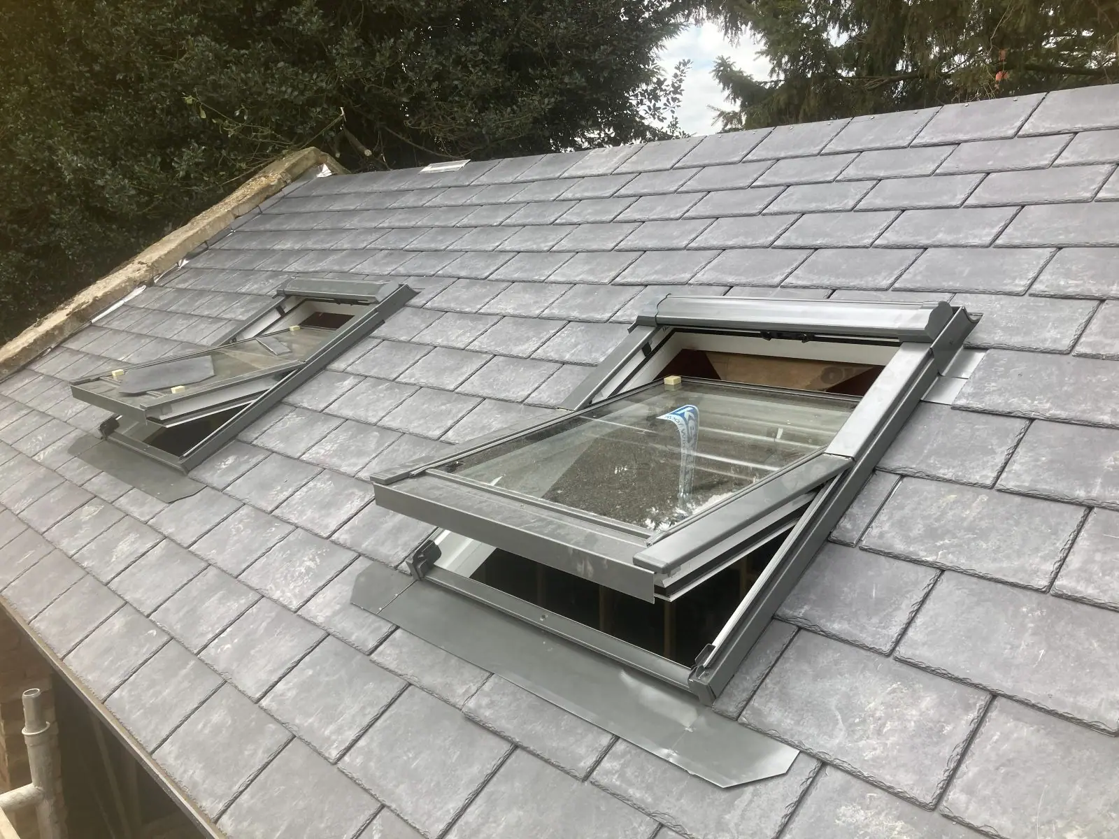 Close view of the roof windows flashed into the slate