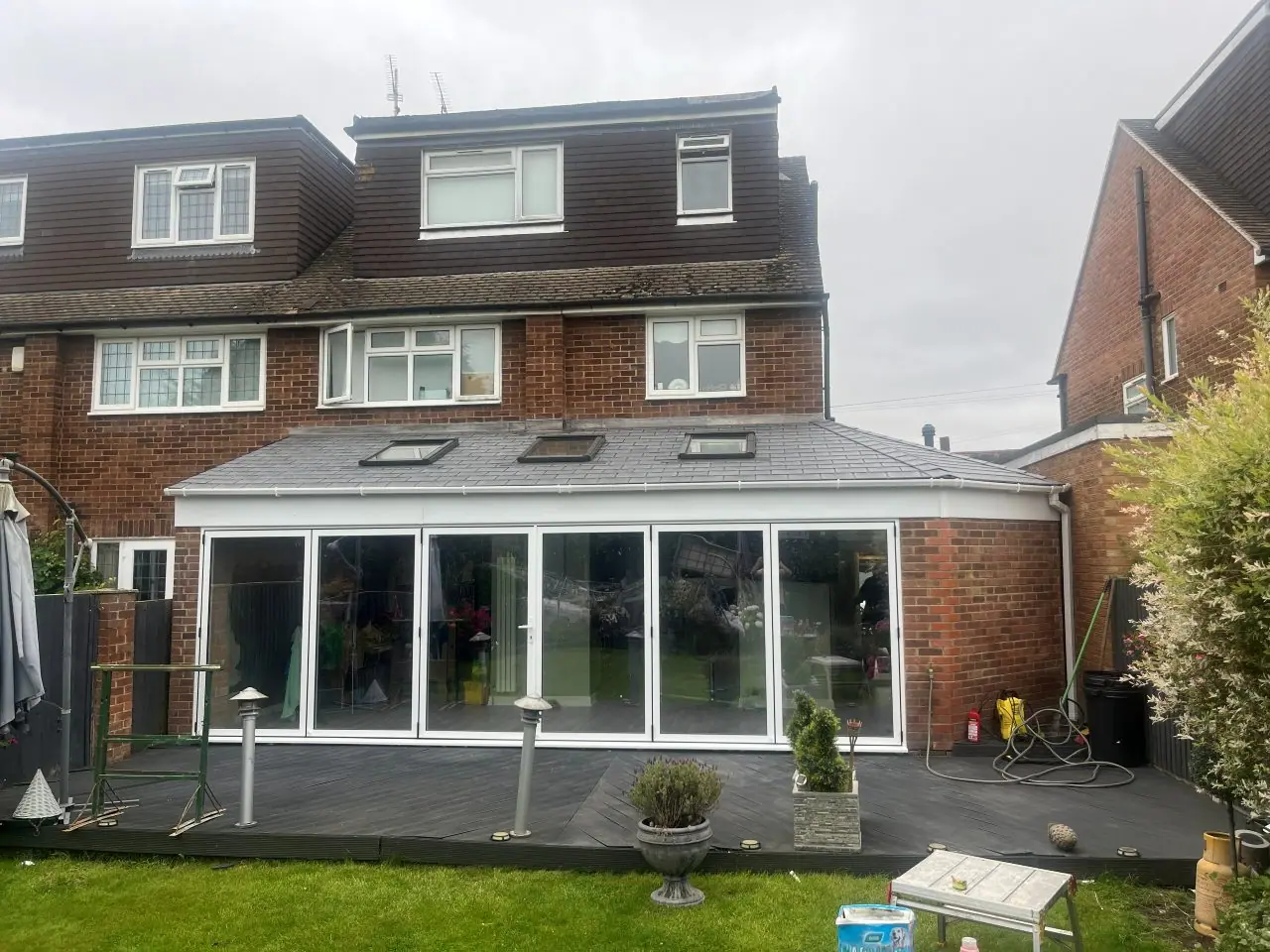 Full-width rear room with bi-fold doors and a tiled roof with three roof windows